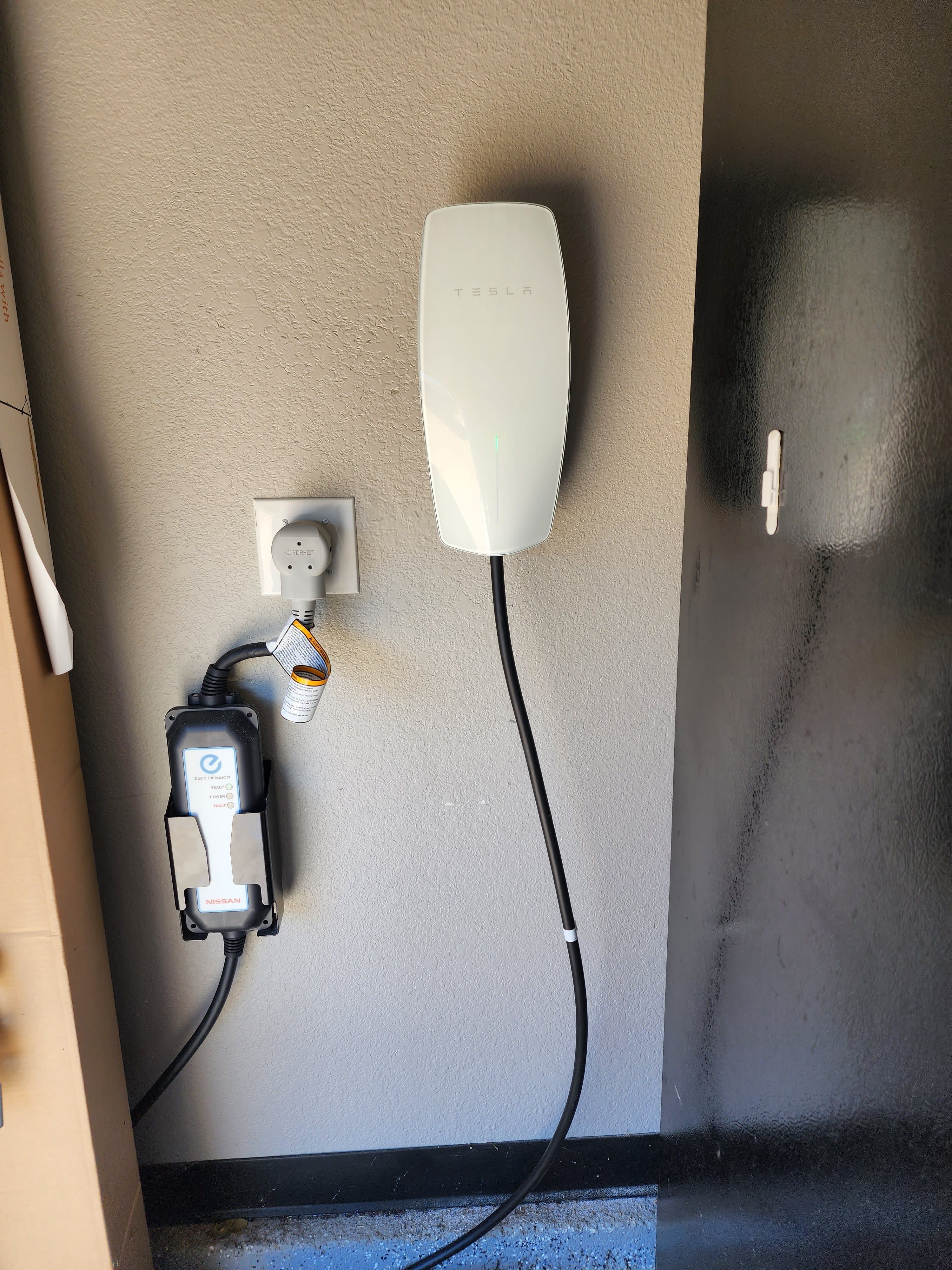 Tesla Wall Connector EV charger installed in a garage